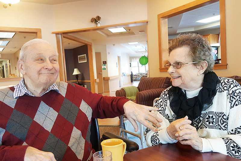 Two people sitting at table