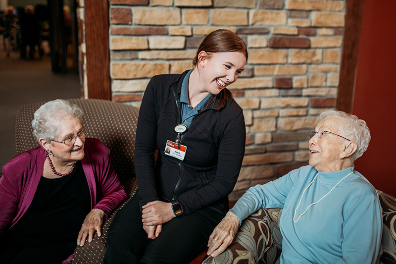 At Auburn Meadows in Waconia, a nurse laughs with residents 